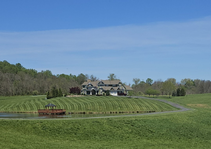 Leaf removal and property cleanup service on a residential lawn in Fauquier County, Virginia